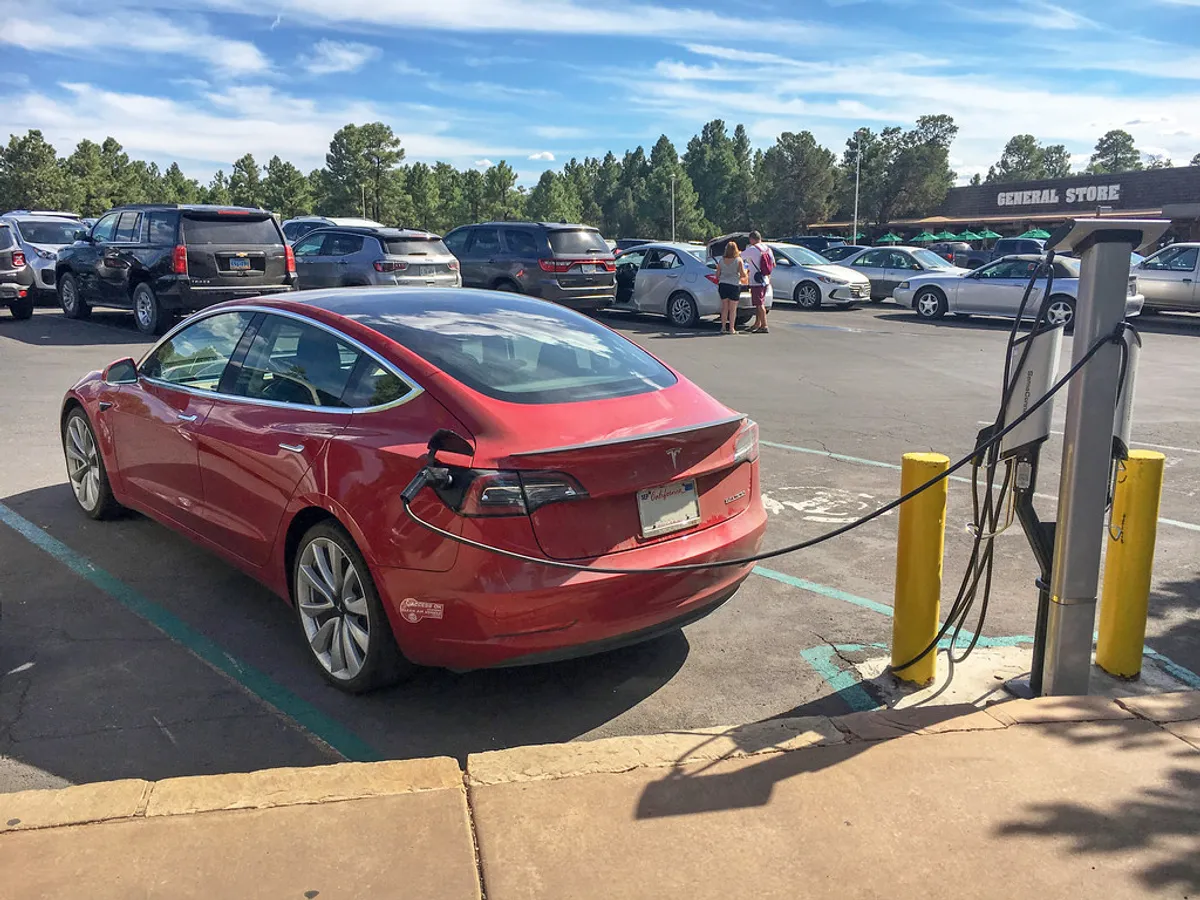 Electric car plugged into a charger